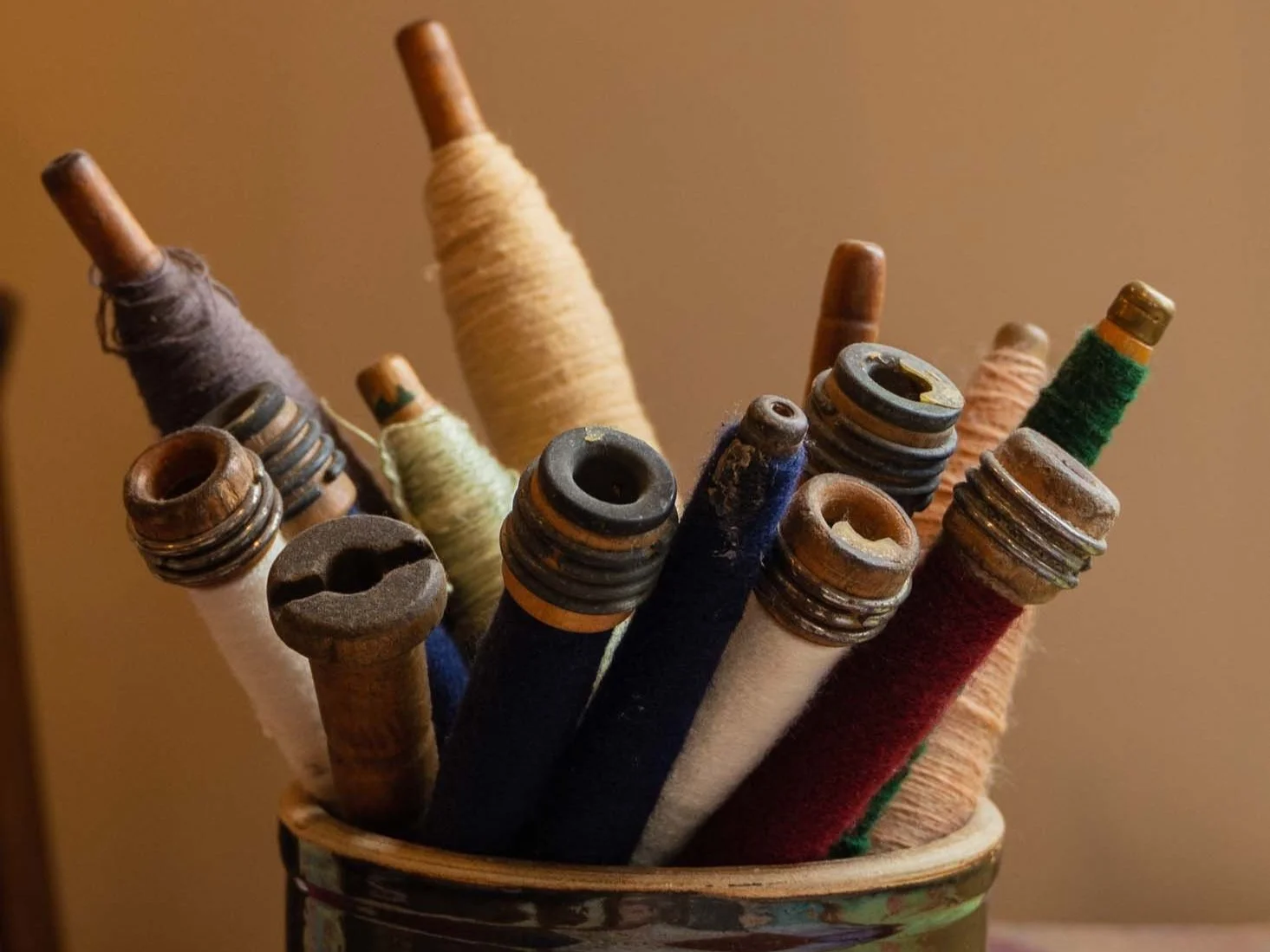 Bundle of rolled-up canvas or textiles in a display jar