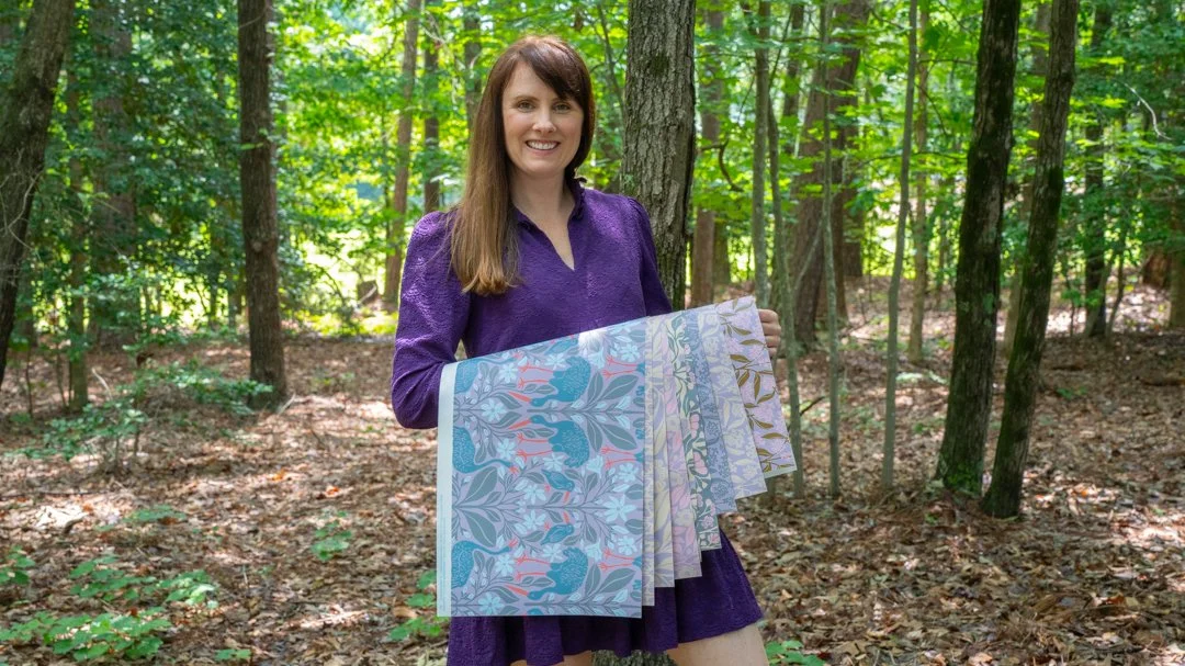 woman holding quilt