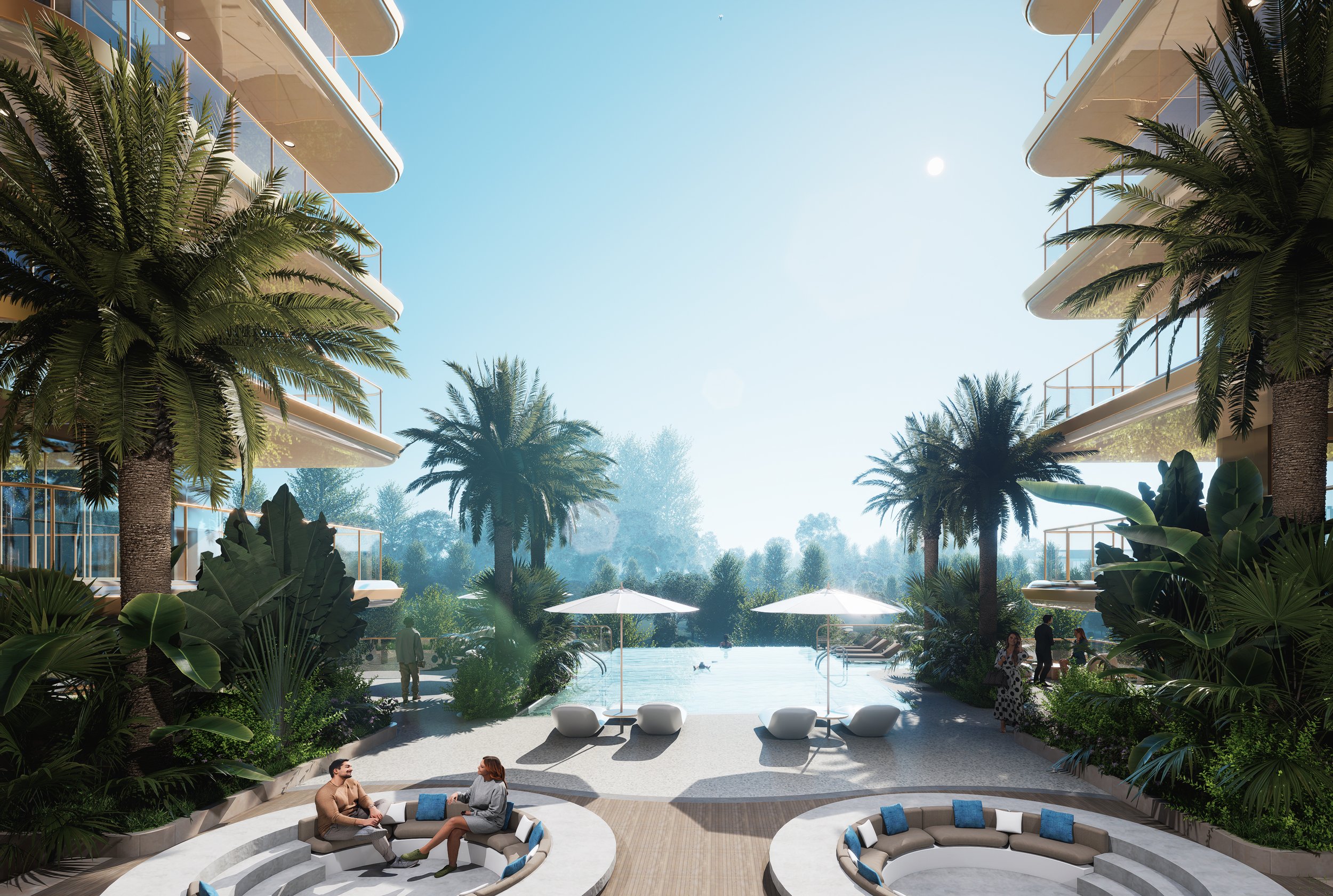 People relaxing outdoors by a pool within a lush, green tropical environment, featuring tall palm trees, modern buildings with balconies, and white umbrellas providing shade.