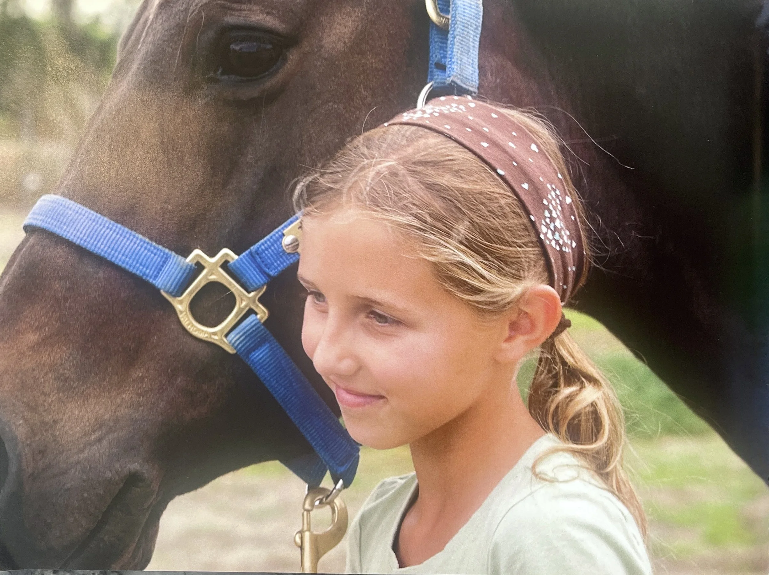Taylor Grant as a child with horse