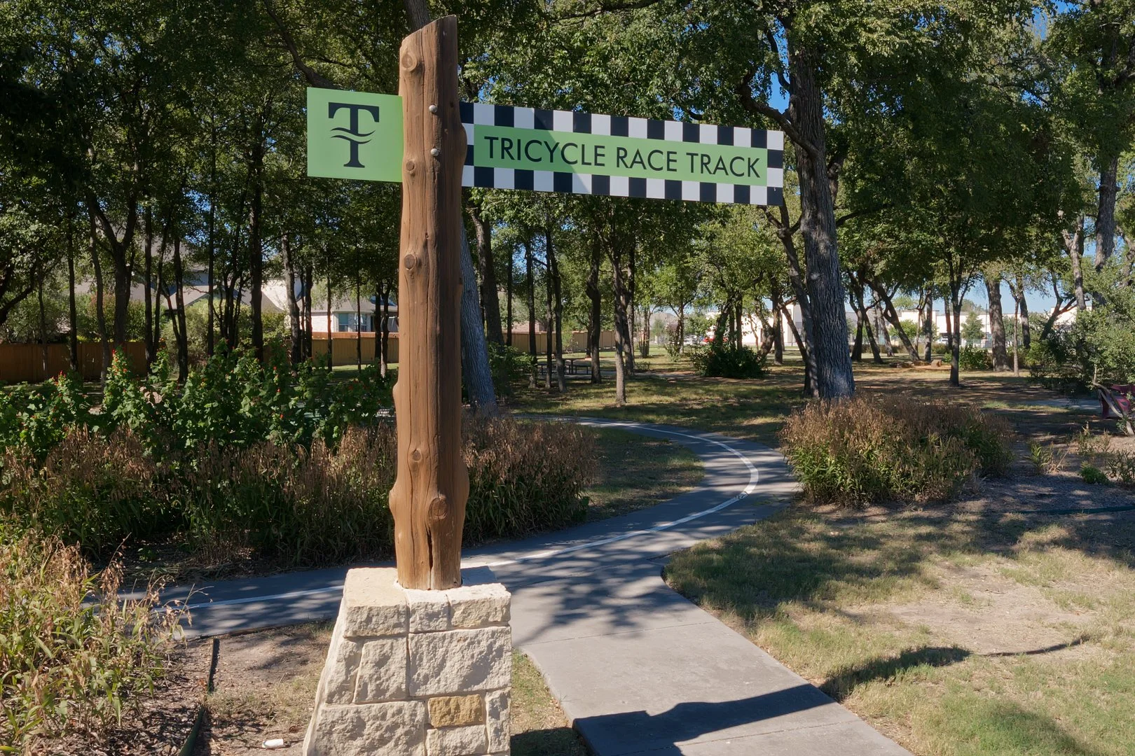 Sign for Tricycle Race Track in Trinity Falls McKinney TX