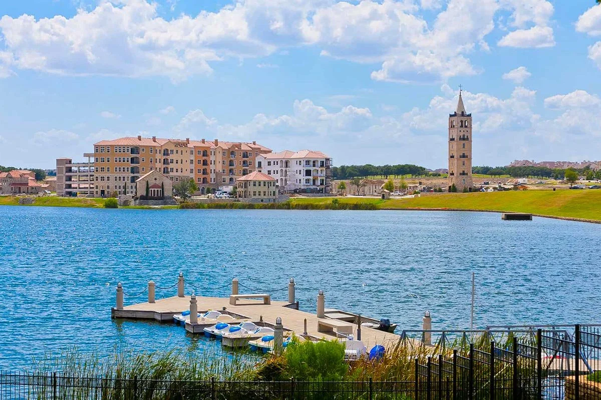 Mediterranean-inspired waterfront architecture in Adriatica Village neighborhood in McKinney Texas at sunset