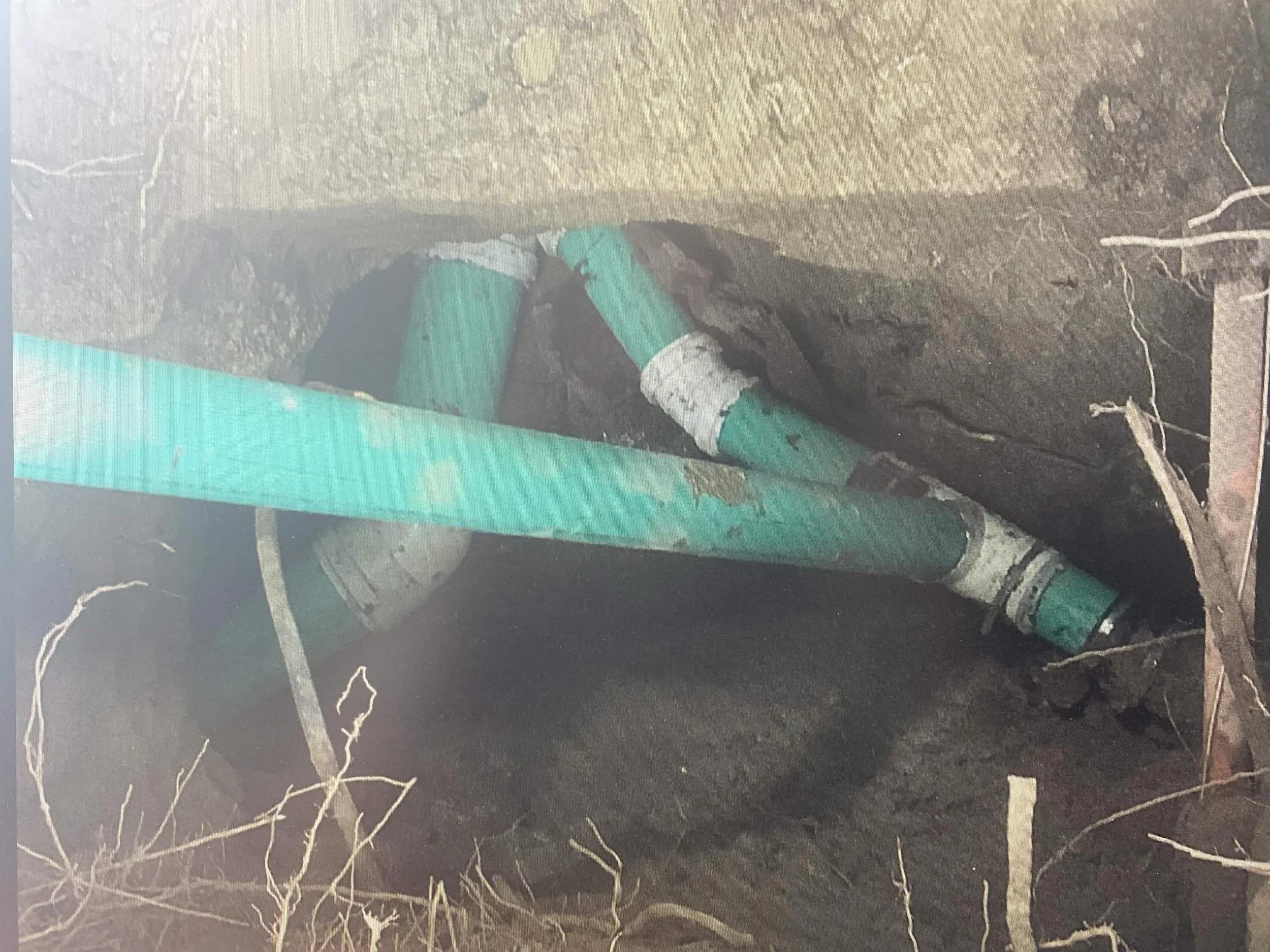 Installed T-connection and new Storm and Sanitary pipe installs at property line