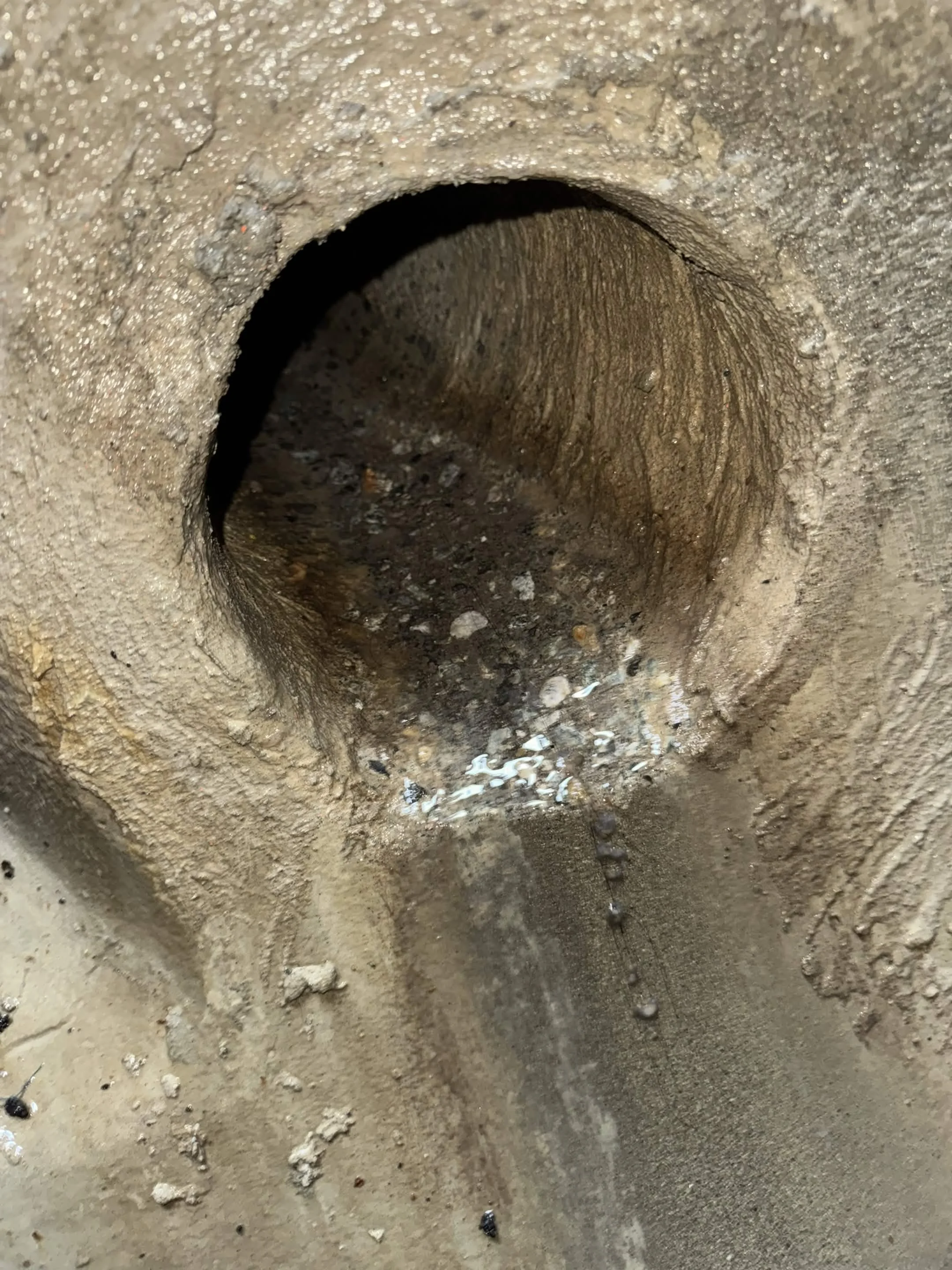 Parged connection in sewer manhole