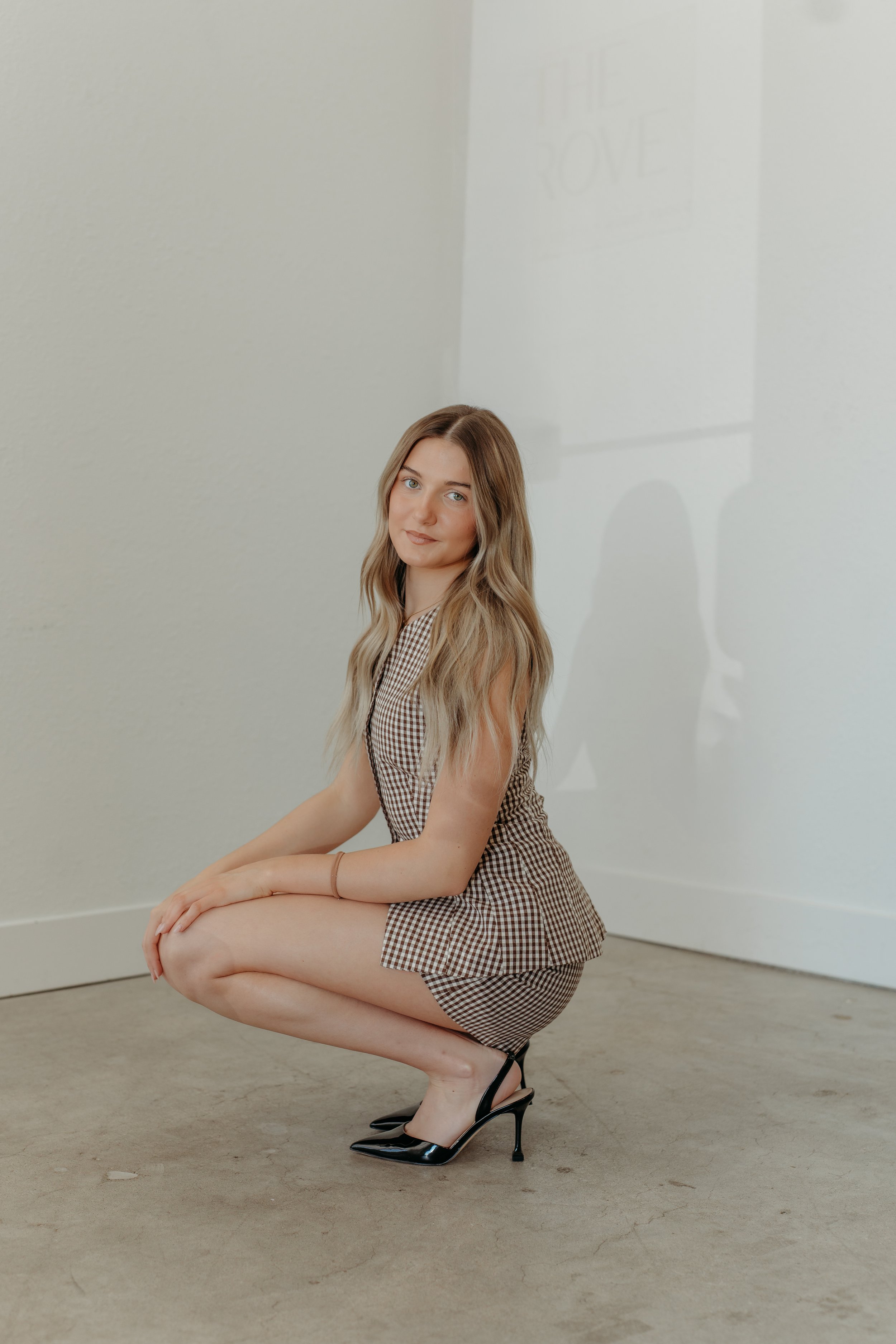 Raegan Becker founder of Haus of Opal in Topeka, Kansas, with long blonde hand-tied invisible bead extensions