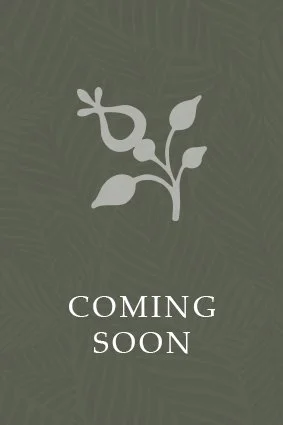 A dark green background with a white plant icon and the text 'Coming Soon'.