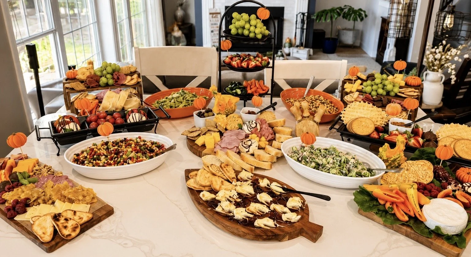 “Elegant fall-themed grazing table by Highly Flavored Catering featuring artisan cheeses, charcuterie, fresh fruit, salads, crackers, and seasonal décor styled for upscale gatherings and celebrations.”