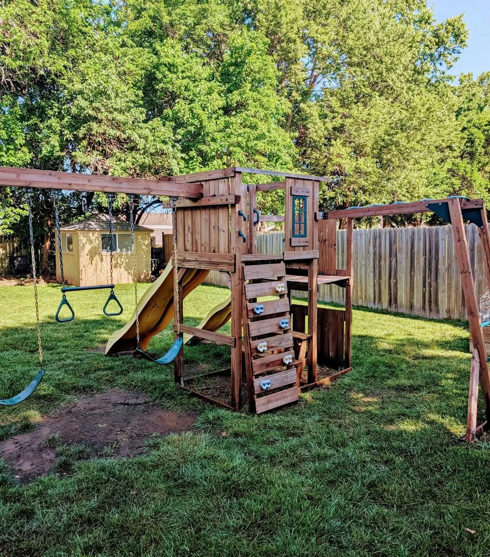 Multi-level wooden playset after soft washing by CurbSprout — Olathe, Johnson County KS
