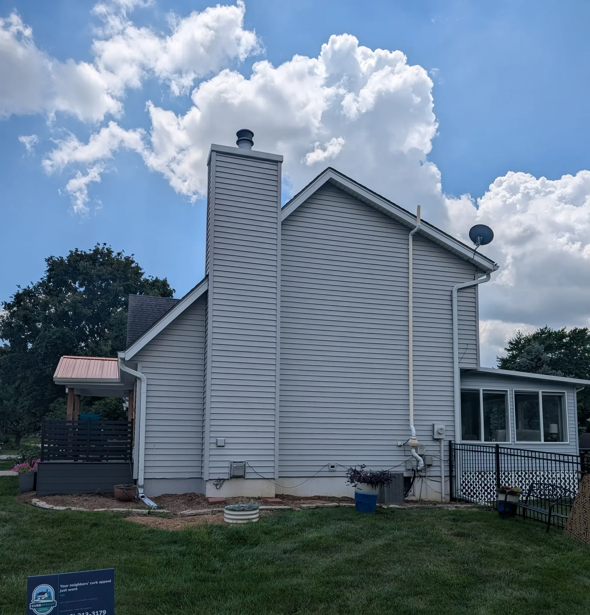 Clean house siding after soft washing by CurbSprout — Olathe, Johnson County KS