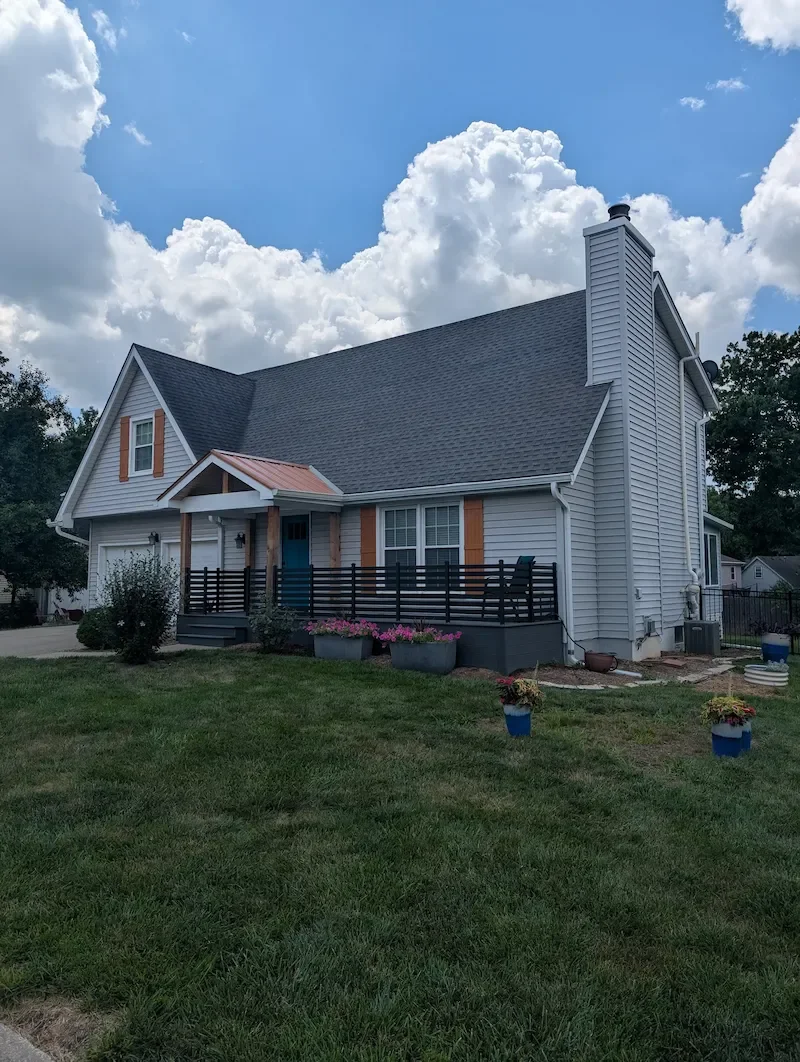 Two-story home exterior with clean vinyl siding after a soft wash, Johnson County Kansas