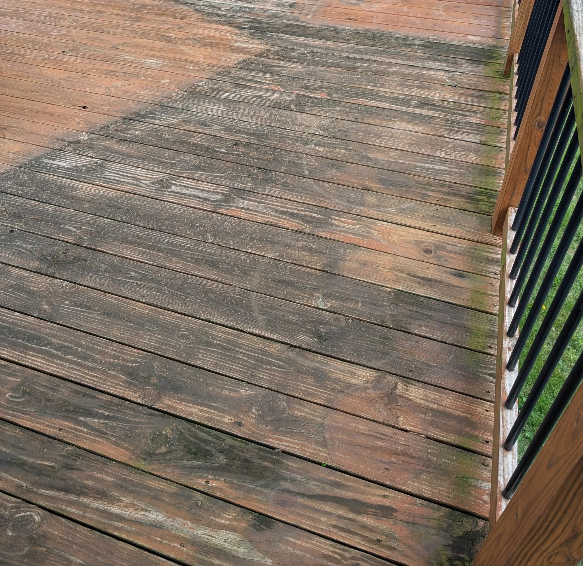 Wood deck with black mildew and dirt before soft washing, Lenexa KS