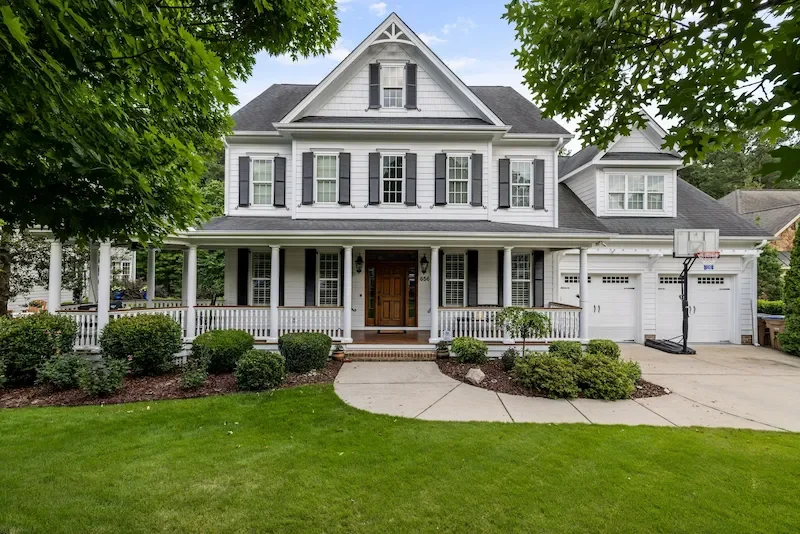 Well-maintained Johnson County home with clean exterior siding and driveway - professional soft washing protects curb appeal and home value in Olathe and Overland Park