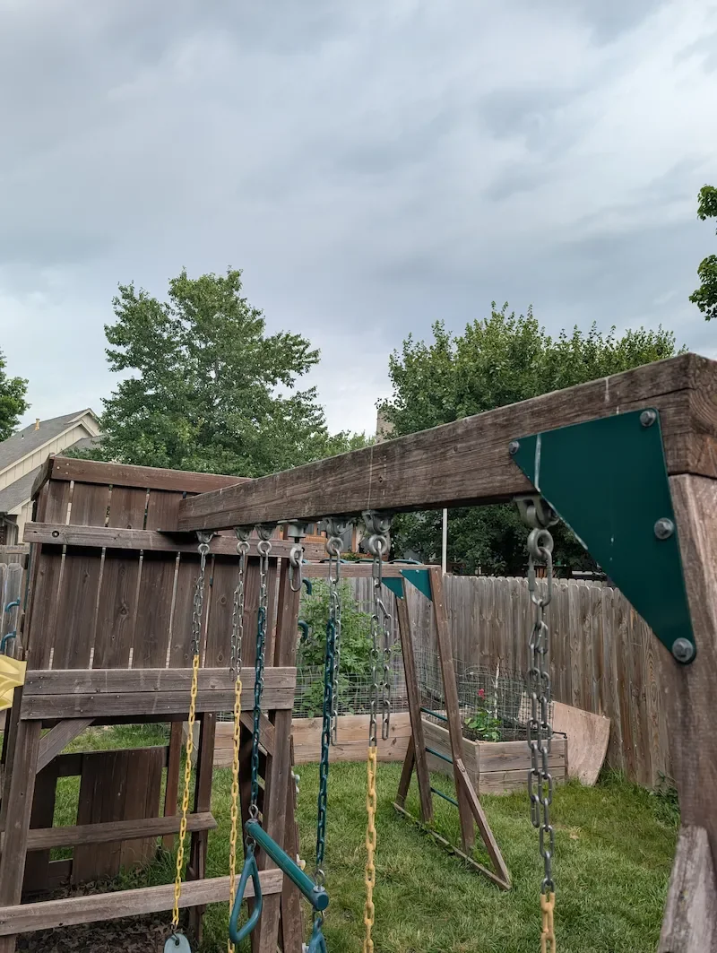 Mold and mildew buildup on backyard playset before soft washing treatment