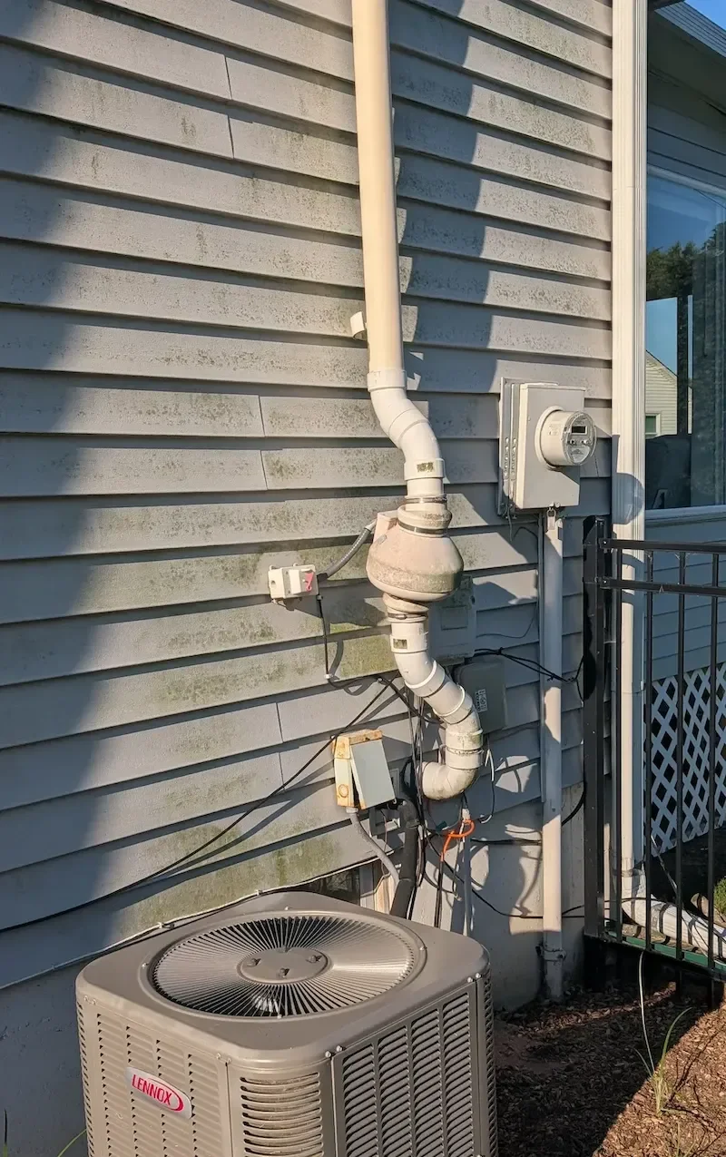 Dark algae streaking on home siding exterior in Johnson County Kansas - caused by Gloeocapsa magma cyanobacteria growth in humid Kansas City climate