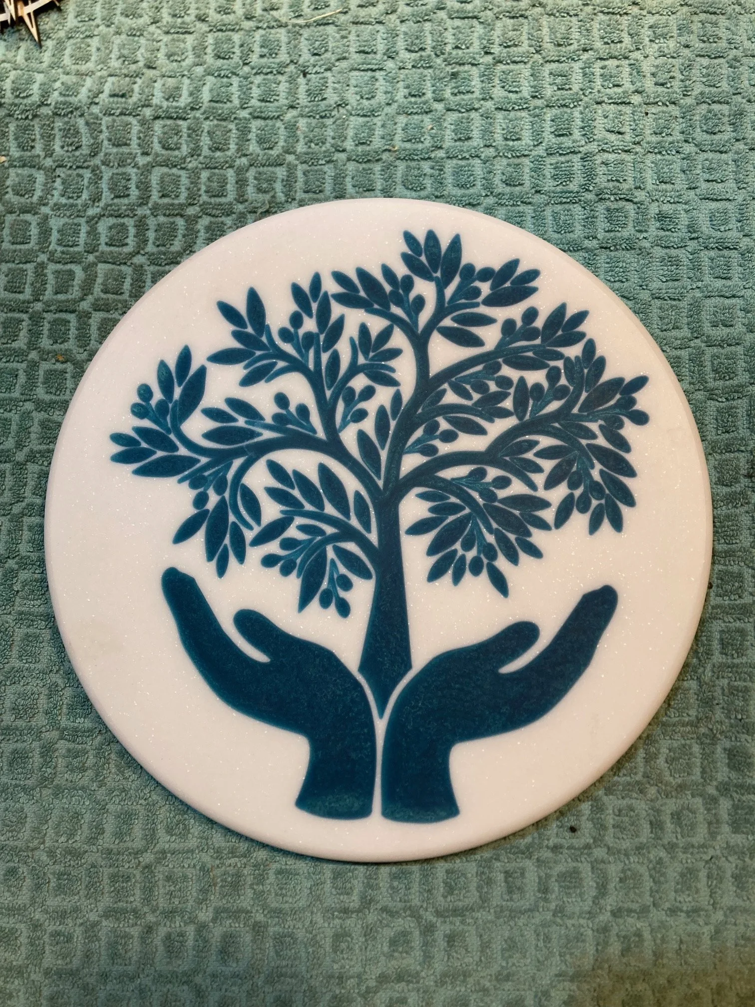 CNC carved designs on Corian and filled with colored epoxy resin