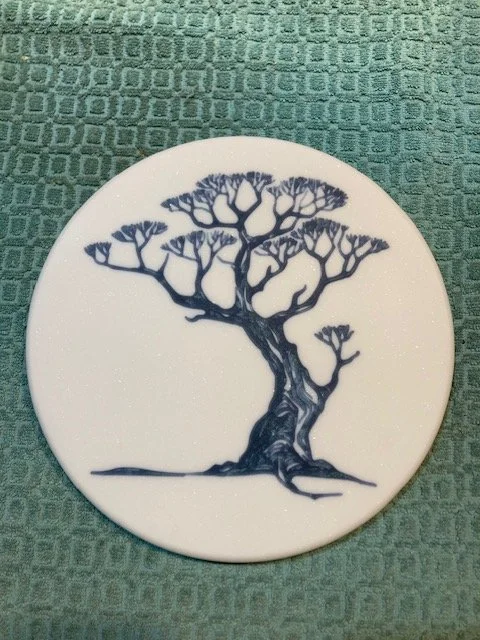 CNC carved designs on Corian and filled with colored epoxy resin