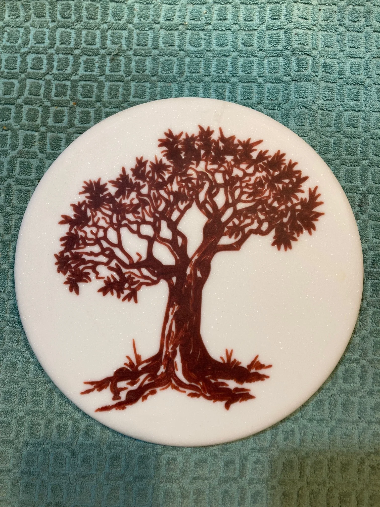 CNC carved designs on Corian and filled with colored epoxy resin