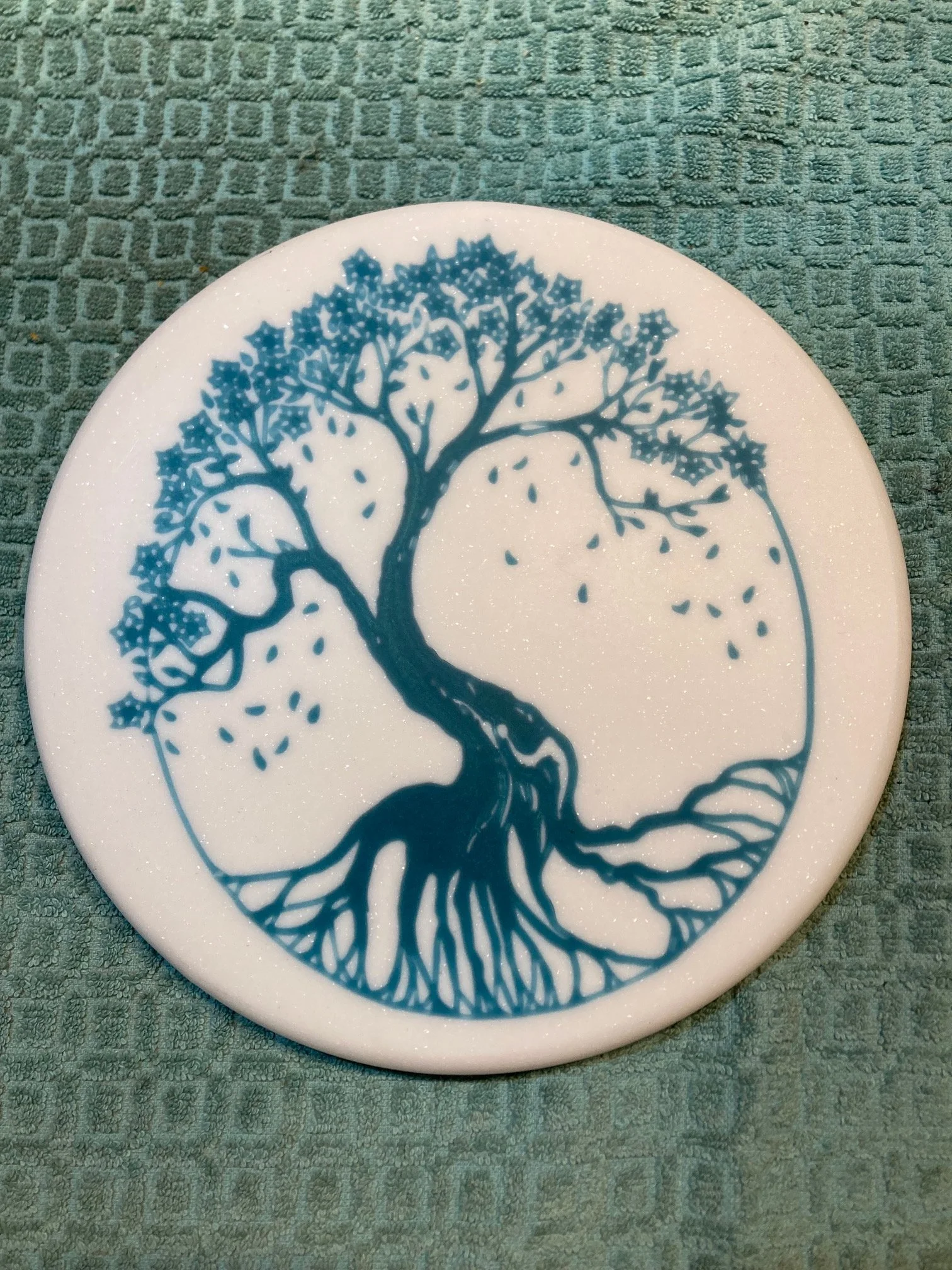CNC carved designs on Corian and filled with colored epoxy resin