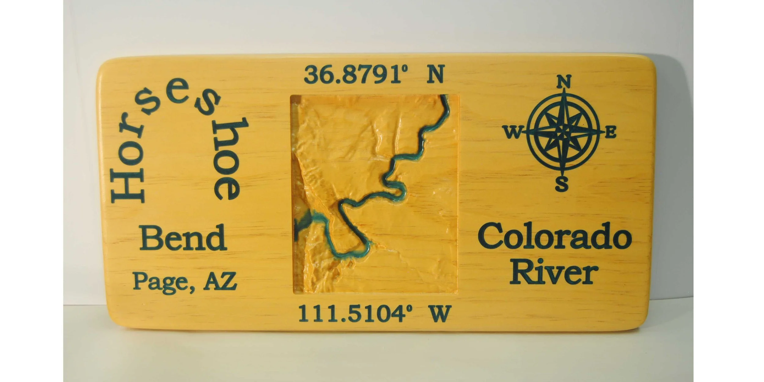 CNC 3D carved topographical map of Horseshoe Bend Page Arizona with words and Colorado River filled with colored epoxy. 11 x 23 inches