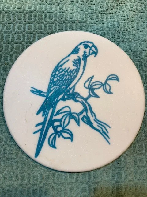 CNC carved designs on Corian and filled with colored epoxy resin