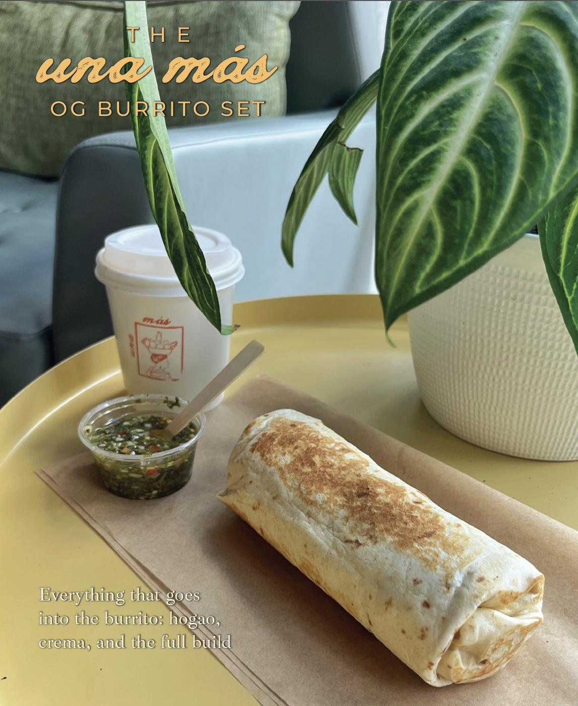 A burrito on a yellow tray with a side of salsa, a cup of coffee, and a potted plant. Textoverlays say "The una más OG Burrito Set" and "Everything that goes into the burrito: hogao, crema, and the full build."
