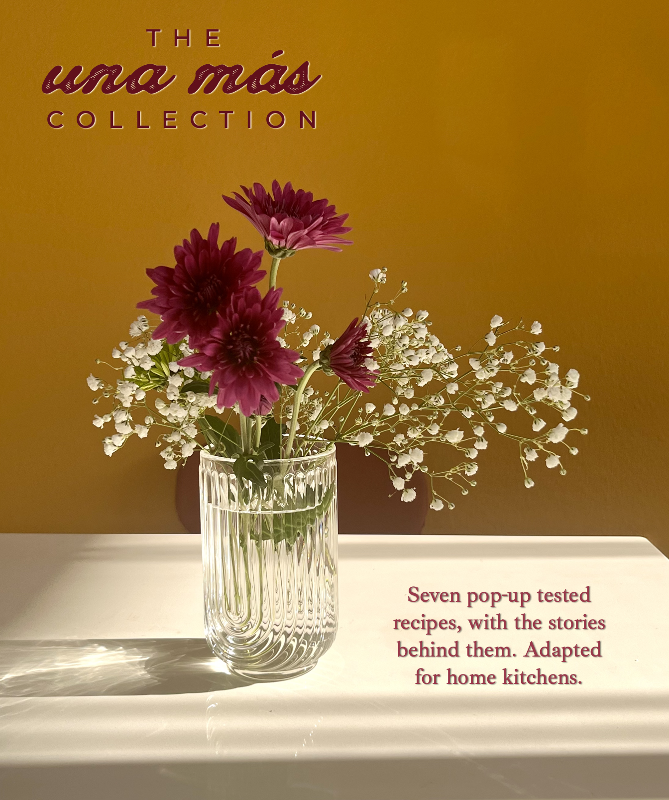 A clear glass vase with pink and white flowers on a white surface against a yellow background, with text about recipes and stories behind them.