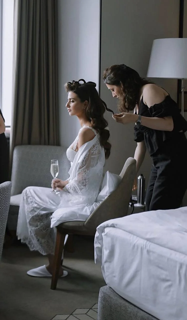 Bridal hairstylist styling wedding updo for bride — results after bridal hair training at ESQAO Academy Los Angeles