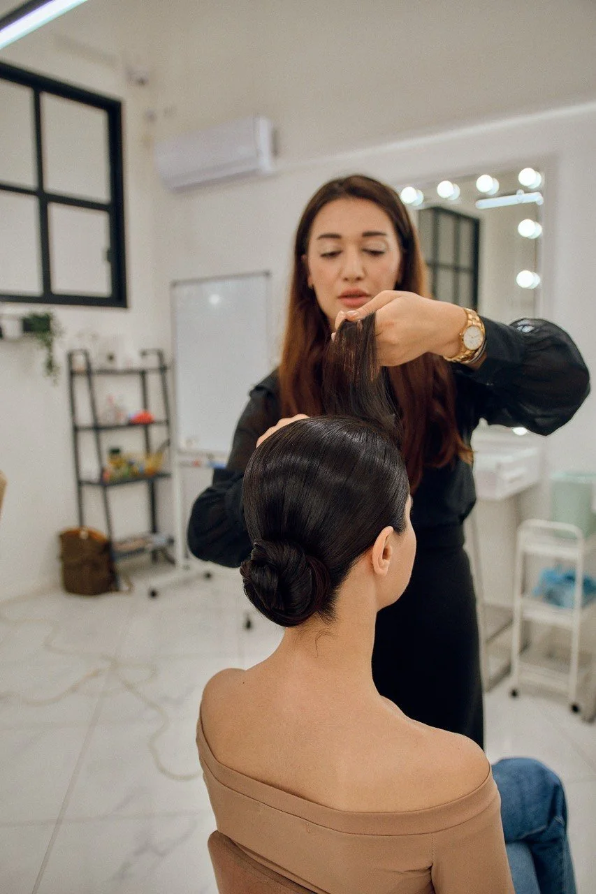 Yanita Esqao teaching private bridal hair training in Los Angeles — one-on-one updo session
