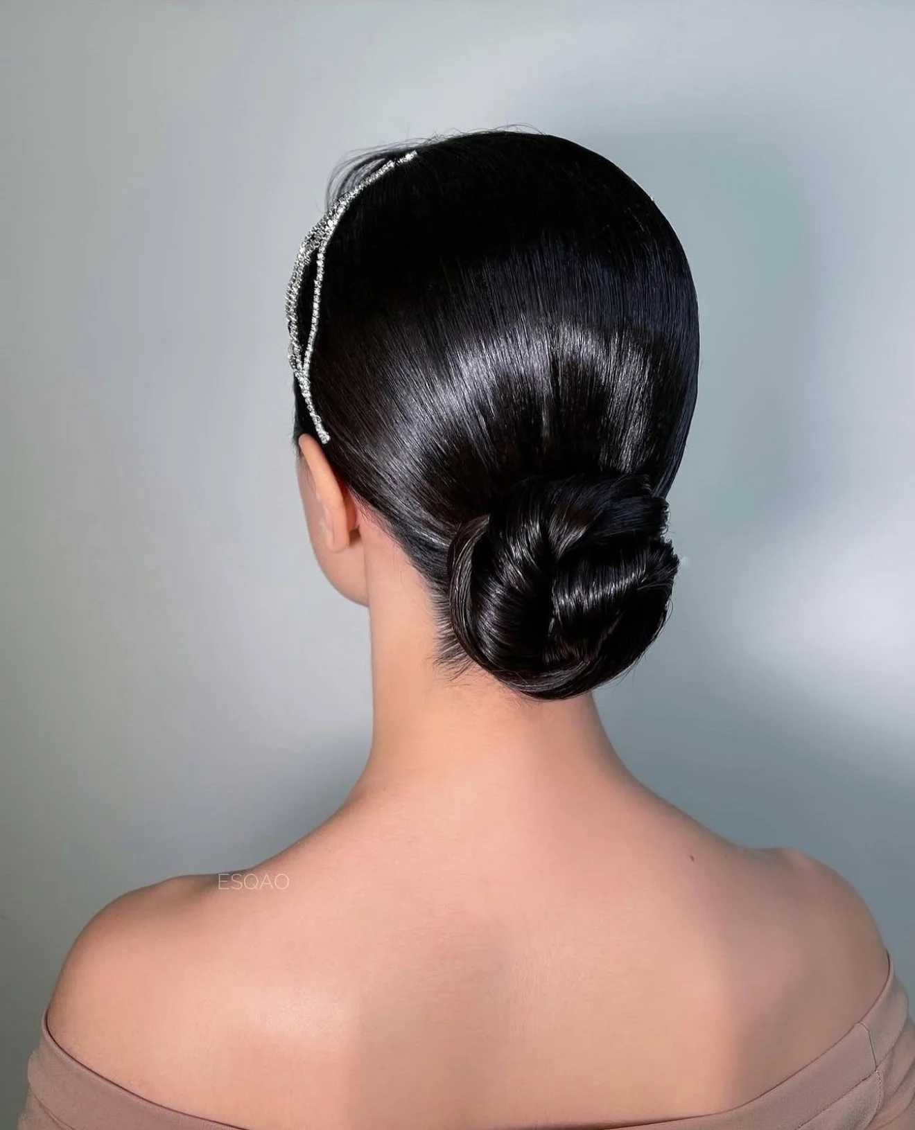 Sleek low bridal bun — minimalist wedding updo by ESQAO Bridal Hair Academy Los Angeles