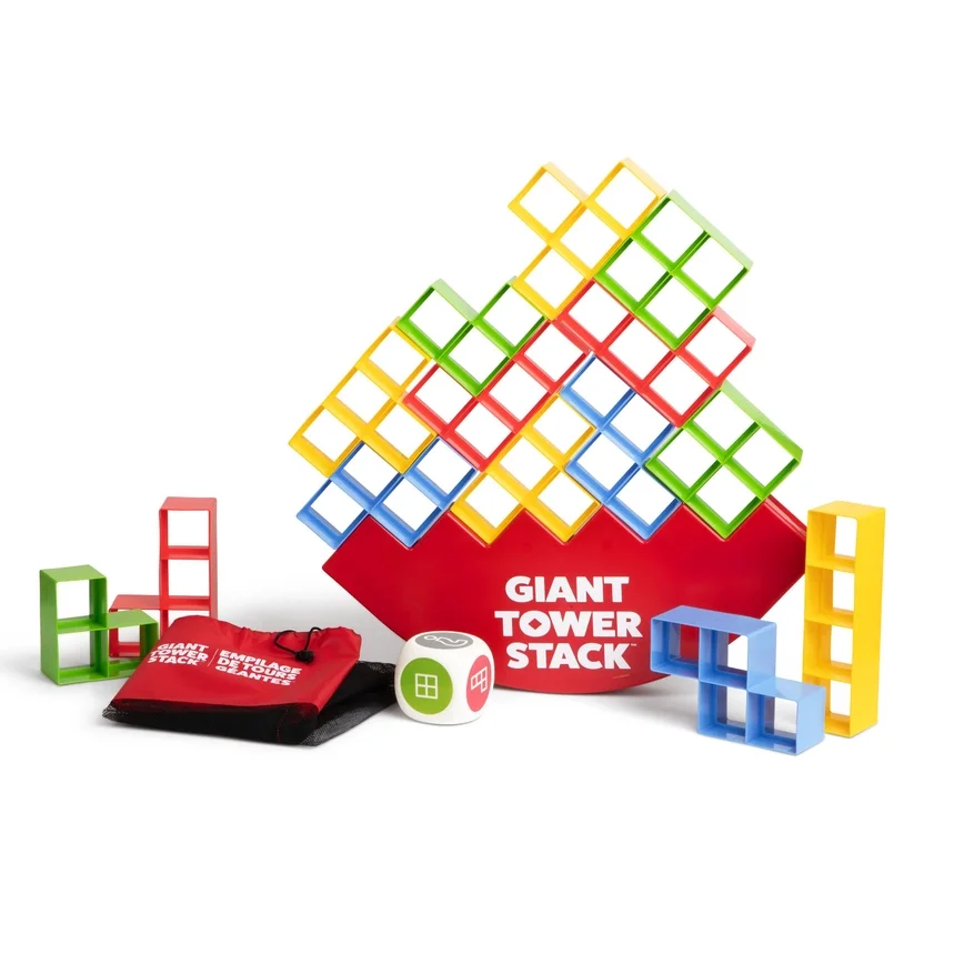 Colorful giant tower stack game with red, yellow, green, and blue plastic blocks, a dice, and a red drawstring bag.