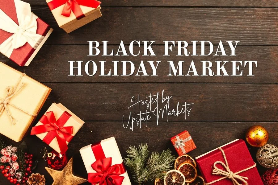 Holiday market poster with wrapped gifts, pinecones, ornaments, and holiday decorations on a wooden background, promoting a Black Friday holiday market hosted by Upscale Markets.