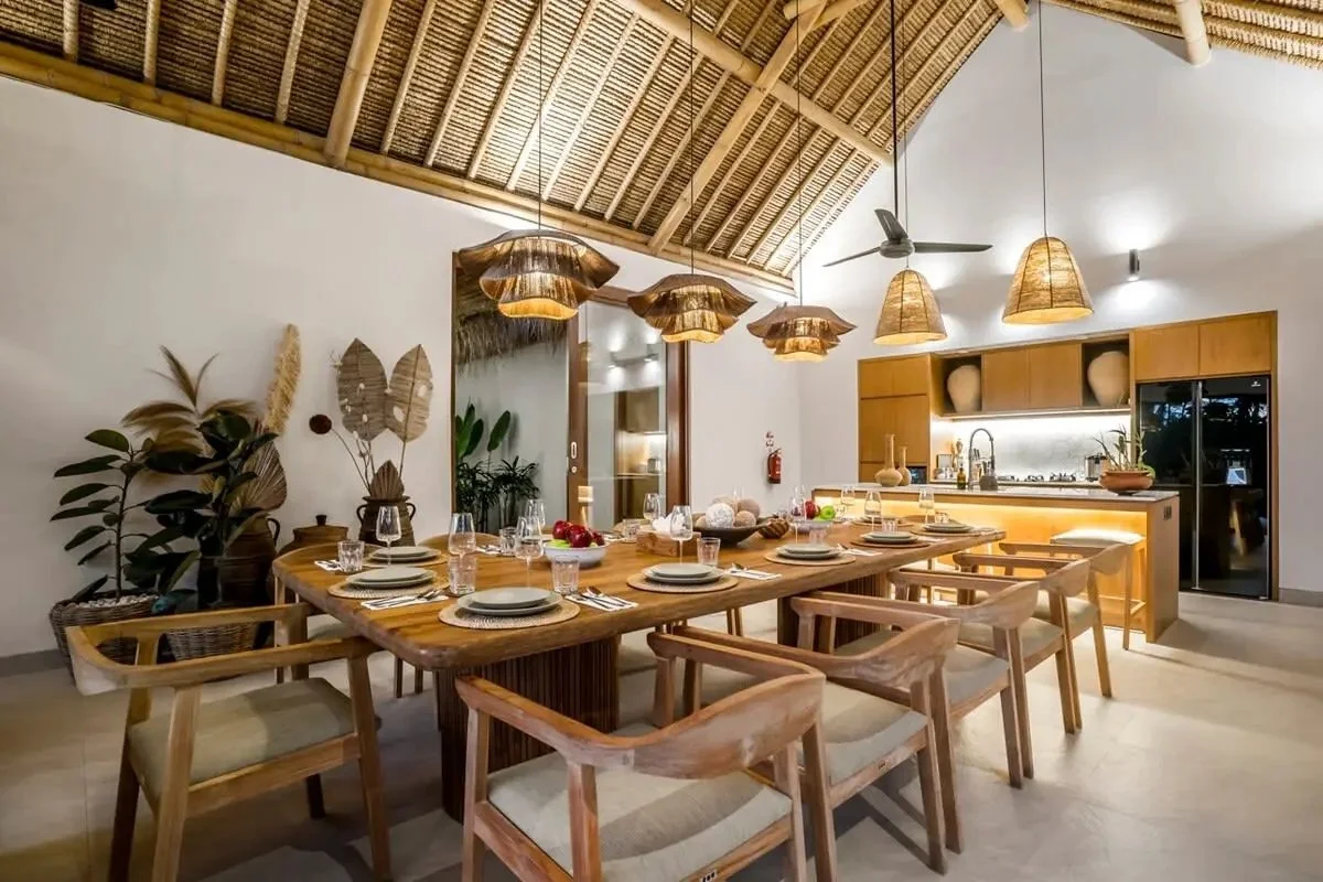 Dining area at Bali yoga and pilates retreat Indonesia tropical restaurant setting with natural wood and pendant lights wellness retreat meals