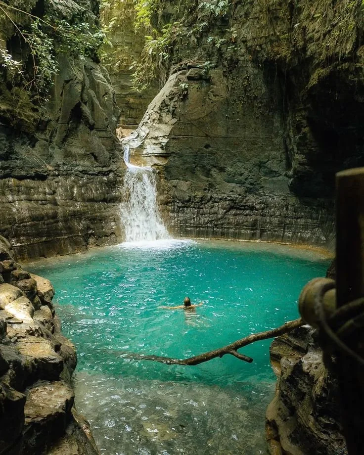 Natural waterfall canyon pool excursion included in Sumba yoga and pilates retreat Indonesia adventure wellness experience