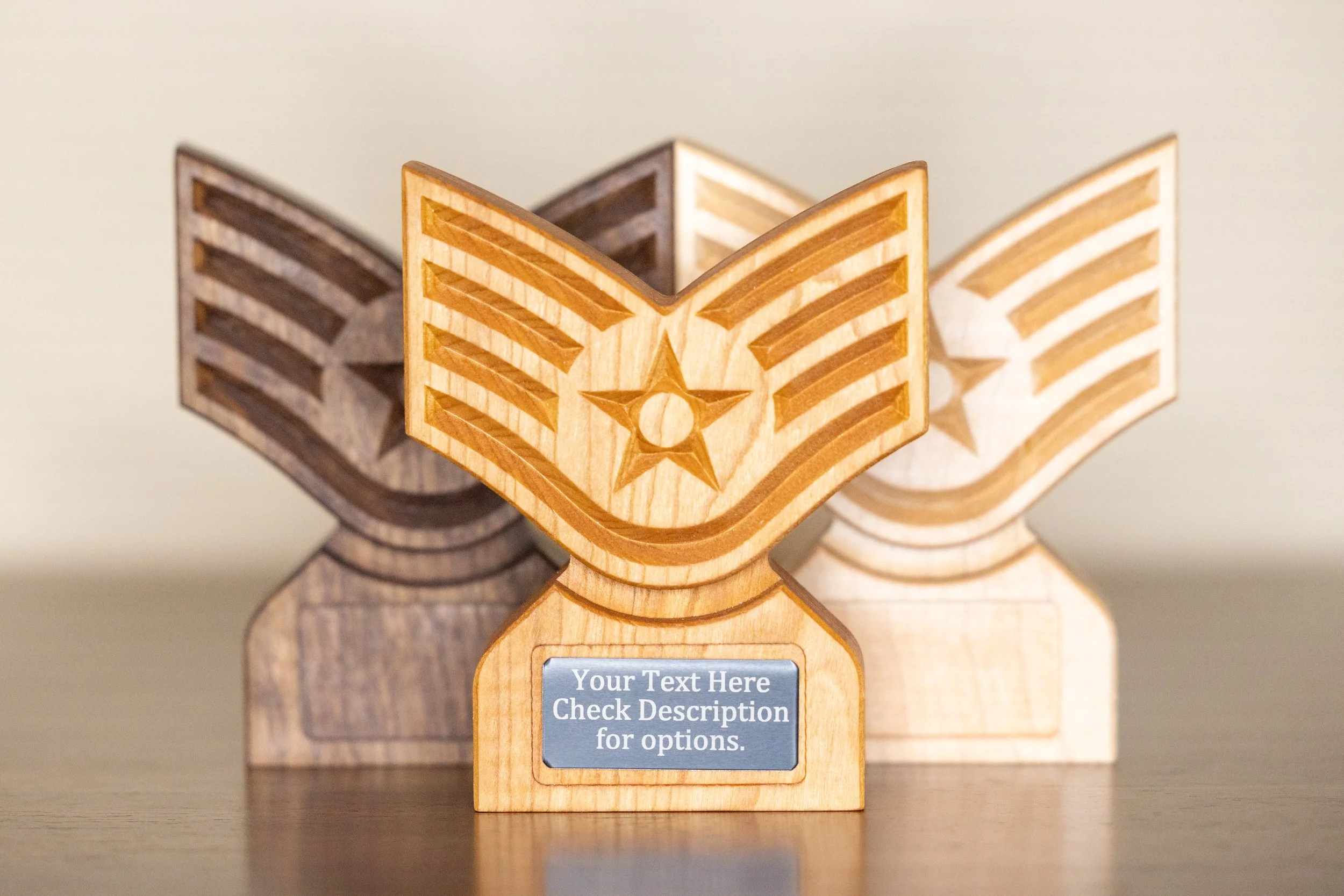 Wooden award trophy with a star and stripe motif, featuring a customizable plaque with the placeholder text 'Your Text Here Check Description for options,' placed on a dark surface against a plain background.