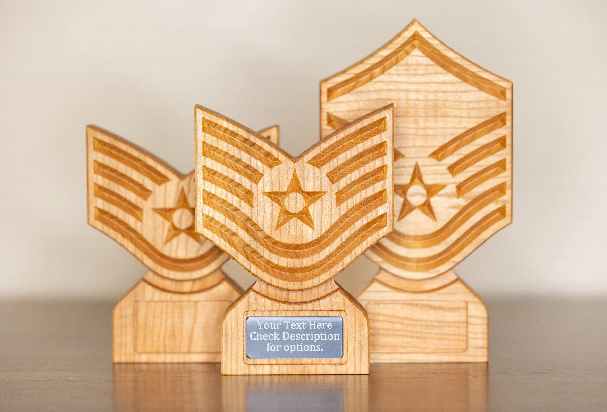 Decorative wooden eagle sculpture with star engravings and a customizable plaque at the bottom.