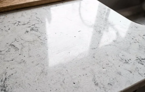 Scratched quartz countertop before repair