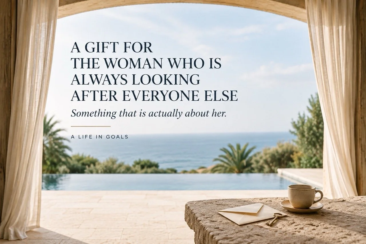 A handwritten envelope and coffee beside a peaceful ocean view, representing a thoughtful gift for the woman who is always looking after everyone else.