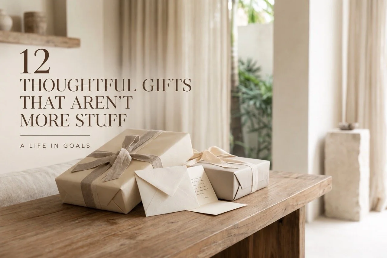Neutral wrapped gifts and handwritten cards on a timber table, representing thoughtful gift ideas that add meaning without adding more clutter.