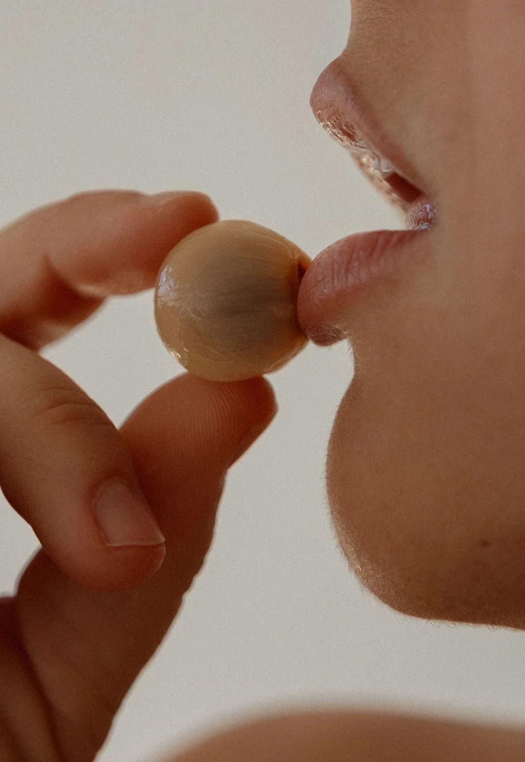 luxury-skincare-solid-cleanser-held-to-lips.jpg