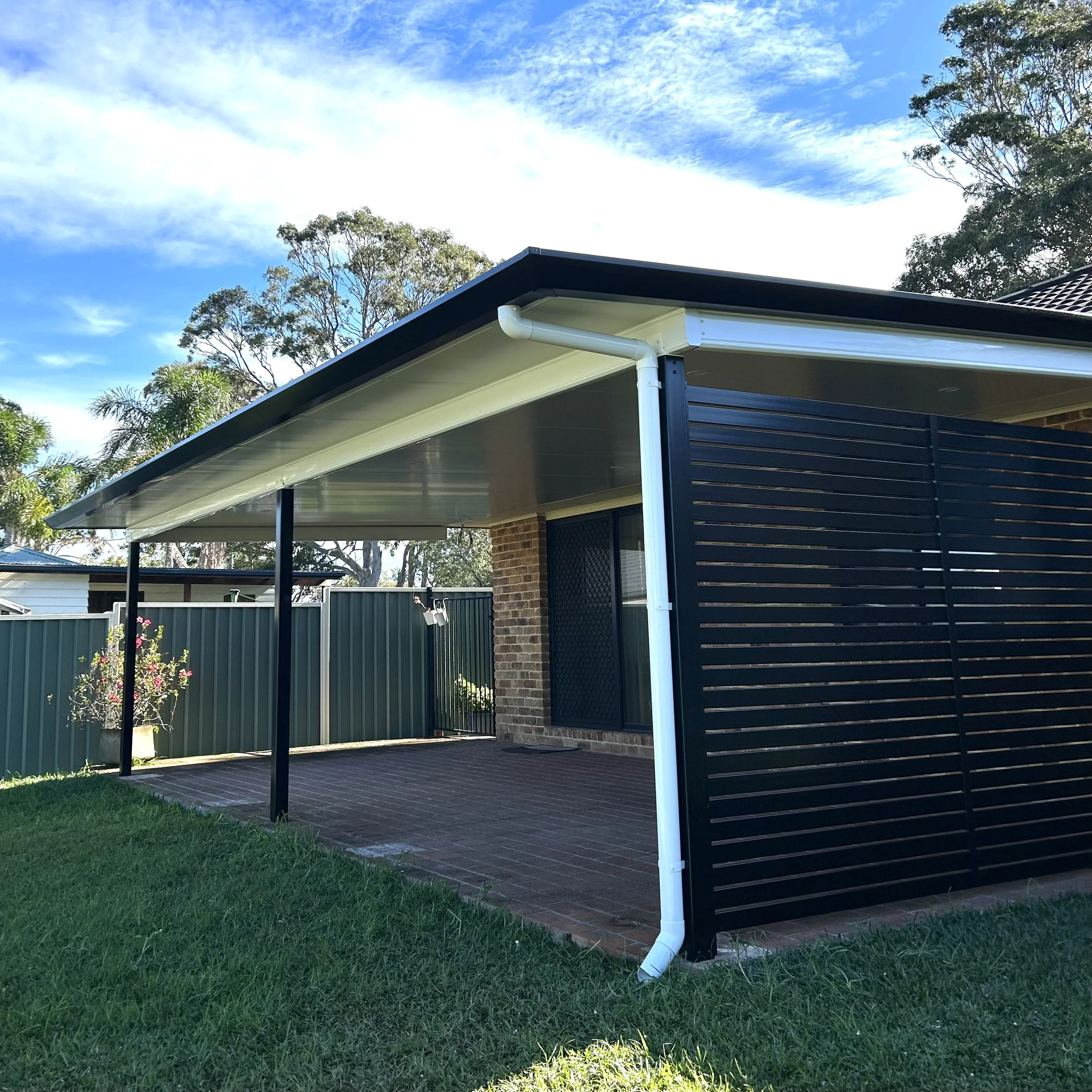 Stratco Outback Cooldek patio and backyard garden views designed by Platinum Decks to blend premium craftsmanship with relaxed outdoor living