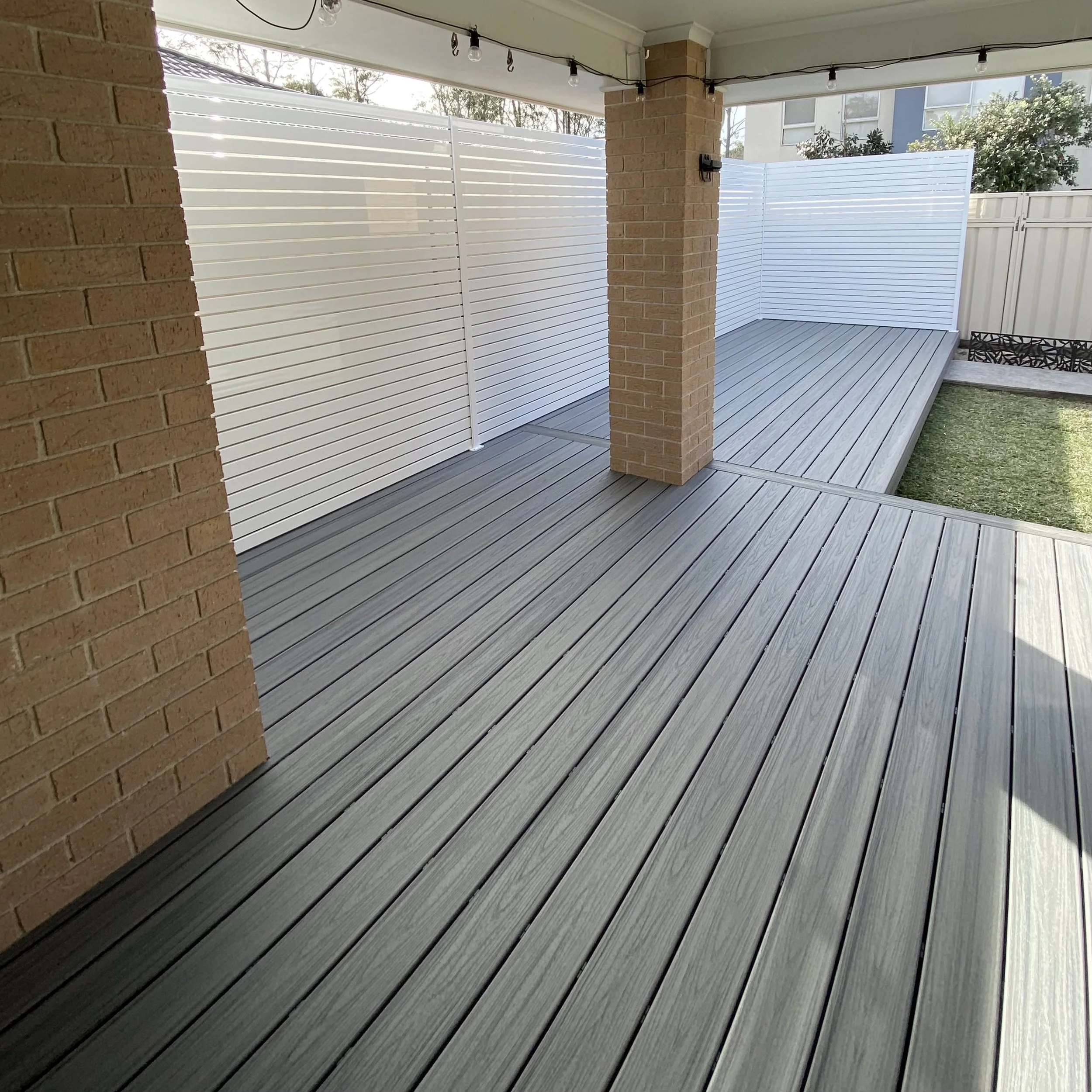 Designer privacy slats styled for contemporary outdoor areas created by Platinum Decks to elevate composite decks with a sleek architectural edge