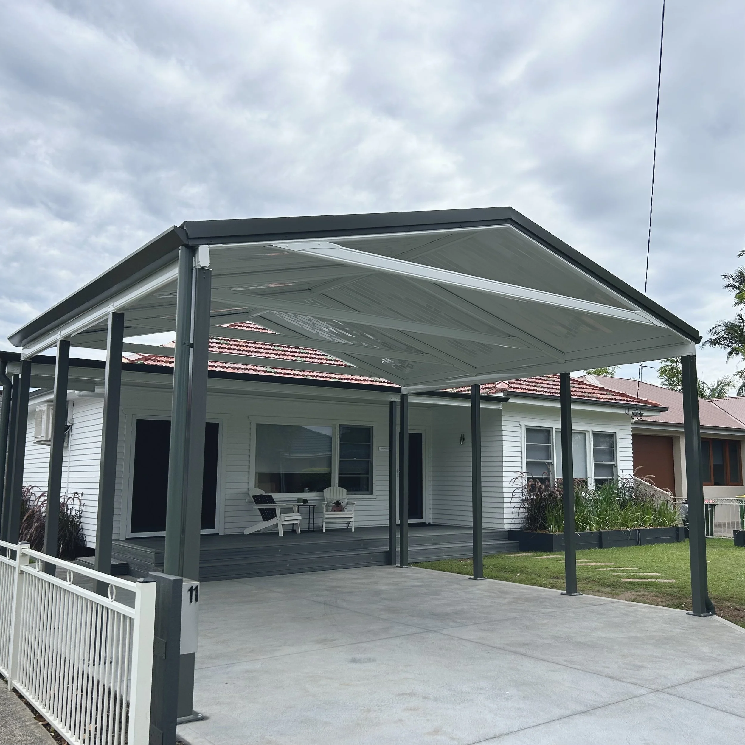 Stratco gable carport completed by Platinum Decks to provide a refined, coastal‑ready entertaining space