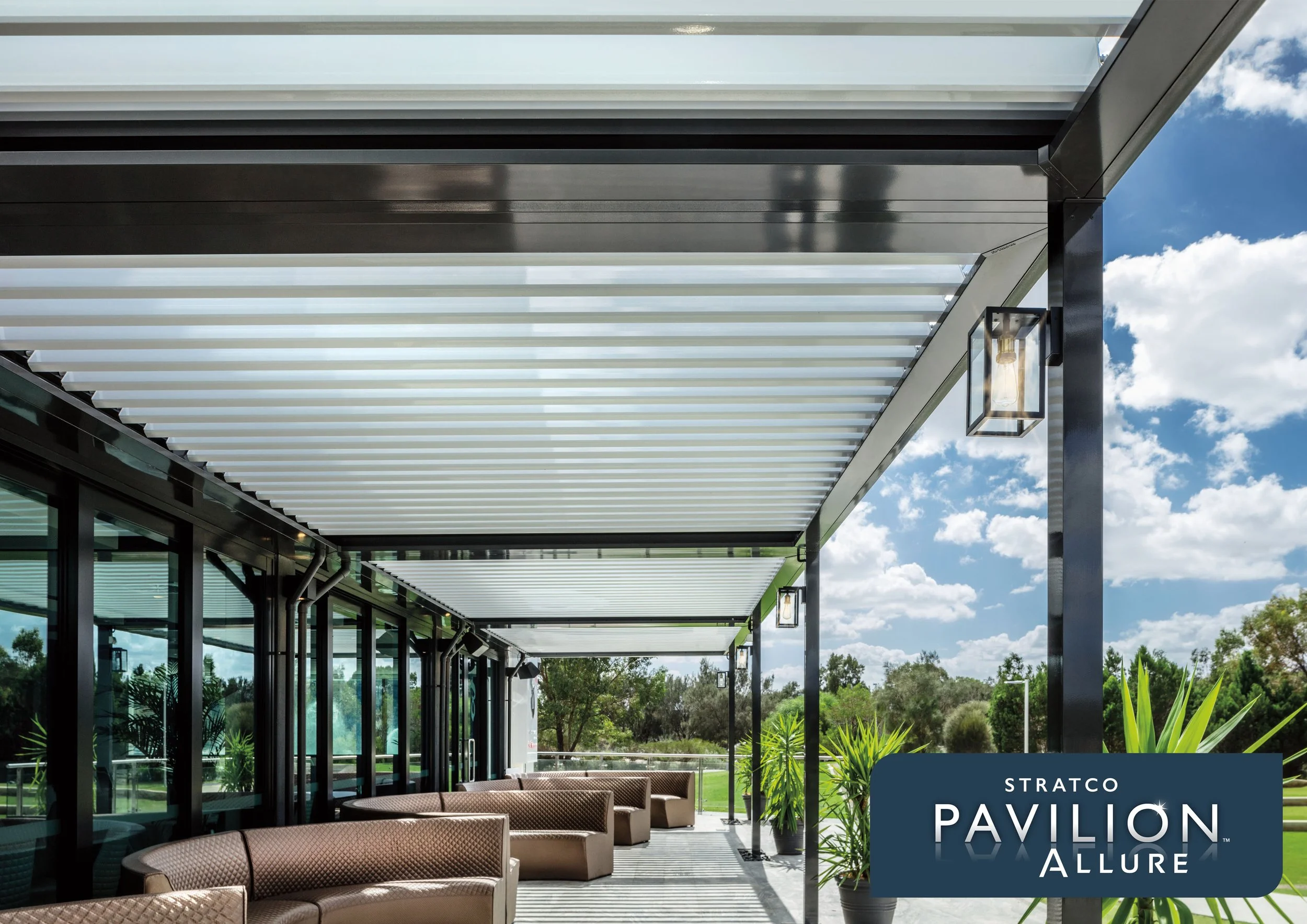 Outdoor seating area with modern furniture under a white slatted patio and pergola with trees and sky in the background. Platinum Decks authorised installer.