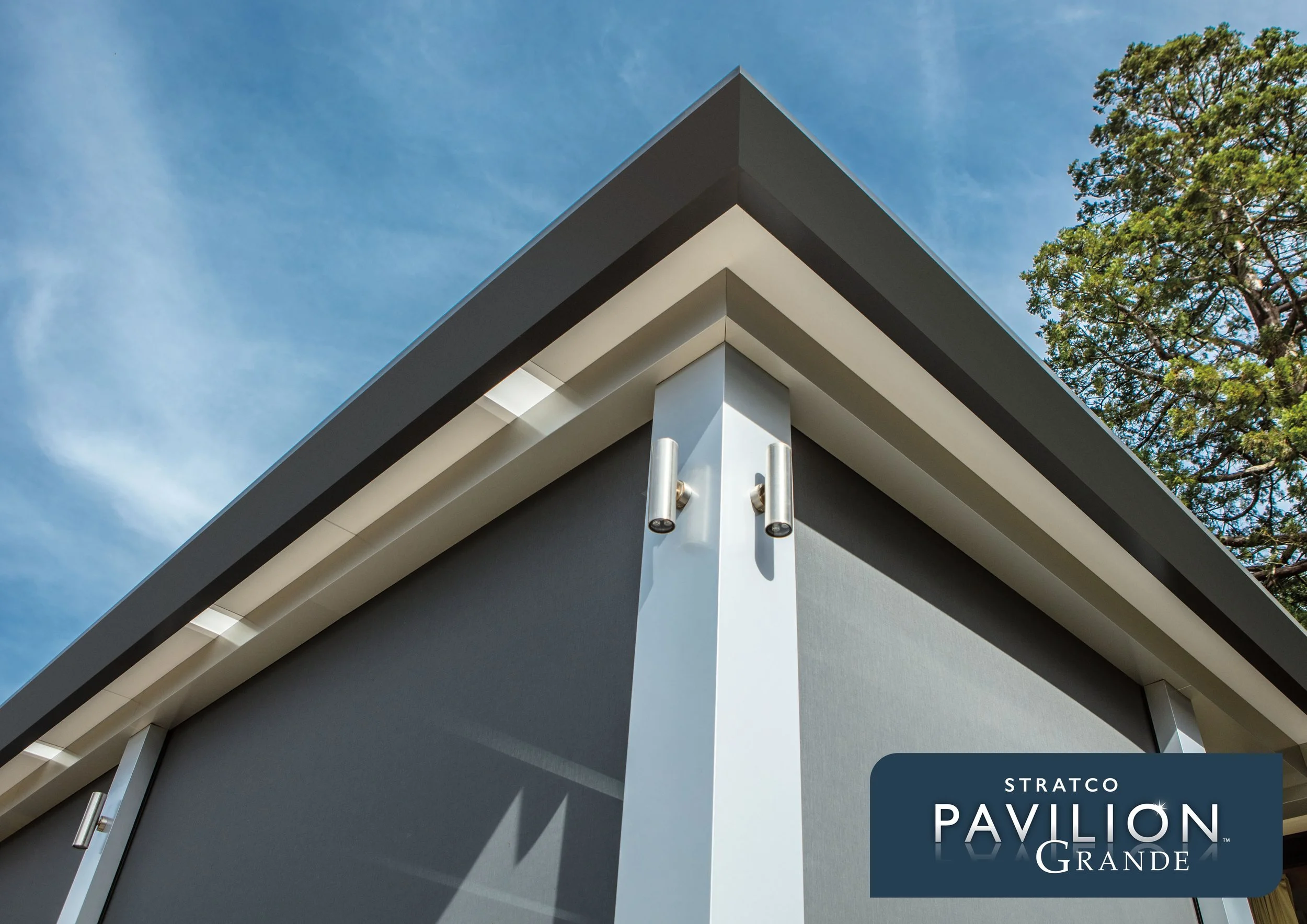 Close-up of the corner of a modern patio roof with sharp angles, metal fixtures, and a blue sky background. Platinum Decks authorised installer.