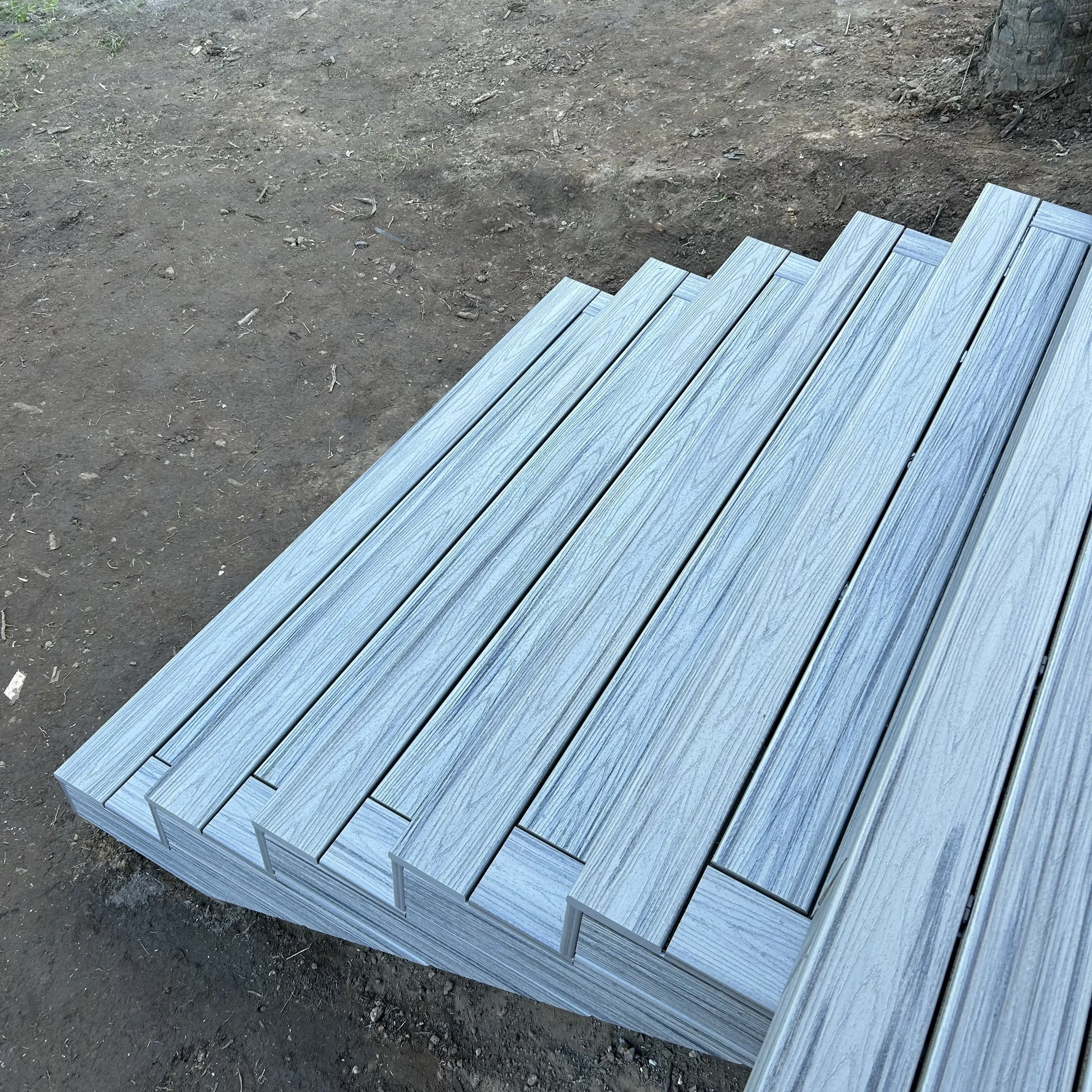 Composite boards prepared for stair and balustrade installation selected by Platinum Decks for their durability and performance in harsh seaside conditions