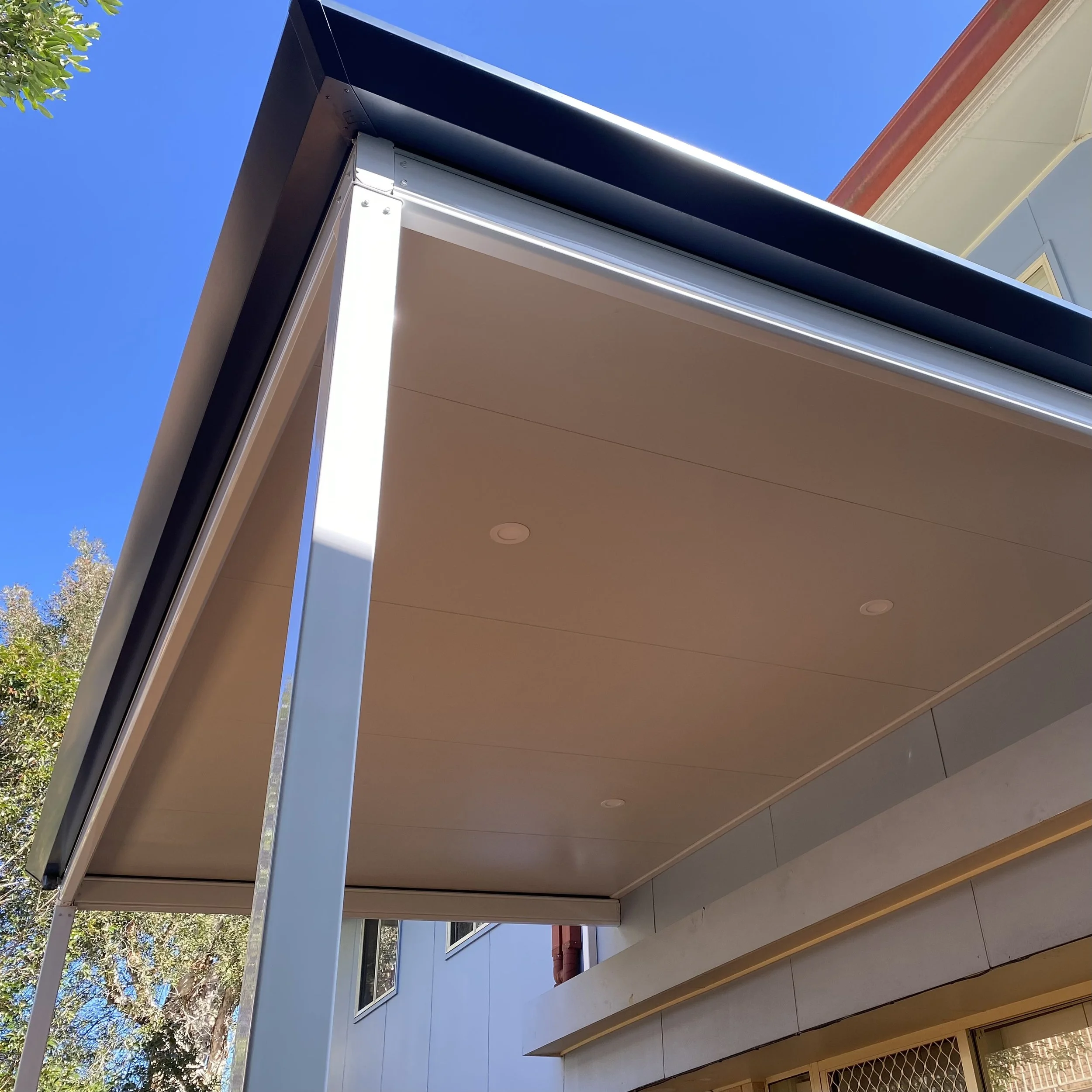 Stratco Outback Cooldek patio and clean architectural lines styled by Platinum Decks to showcase contemporary outdoor design
