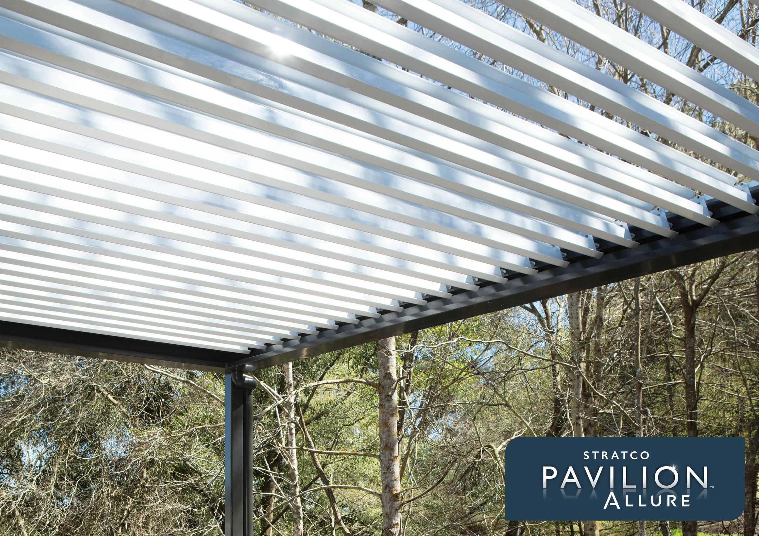 Modern white architectural structure with horizontal slats, part of Pavilion Allure, set outdoors with trees in the background. Platinum Decks authorised installer.