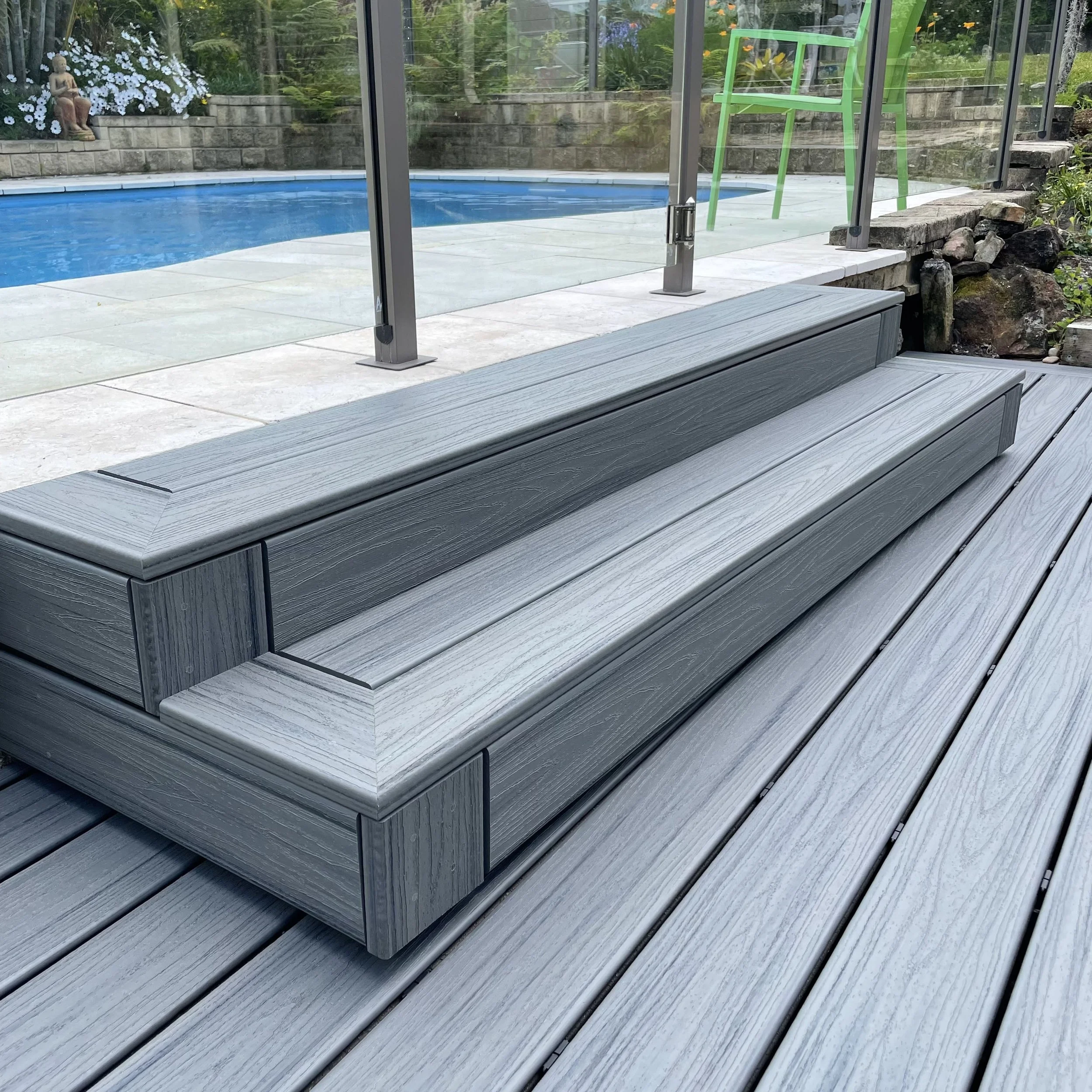 Grey composite steps paired with crisp white balustrades designed by Platinum Decks to deliver a premium, long‑lasting finish ideal for Central Coast homes