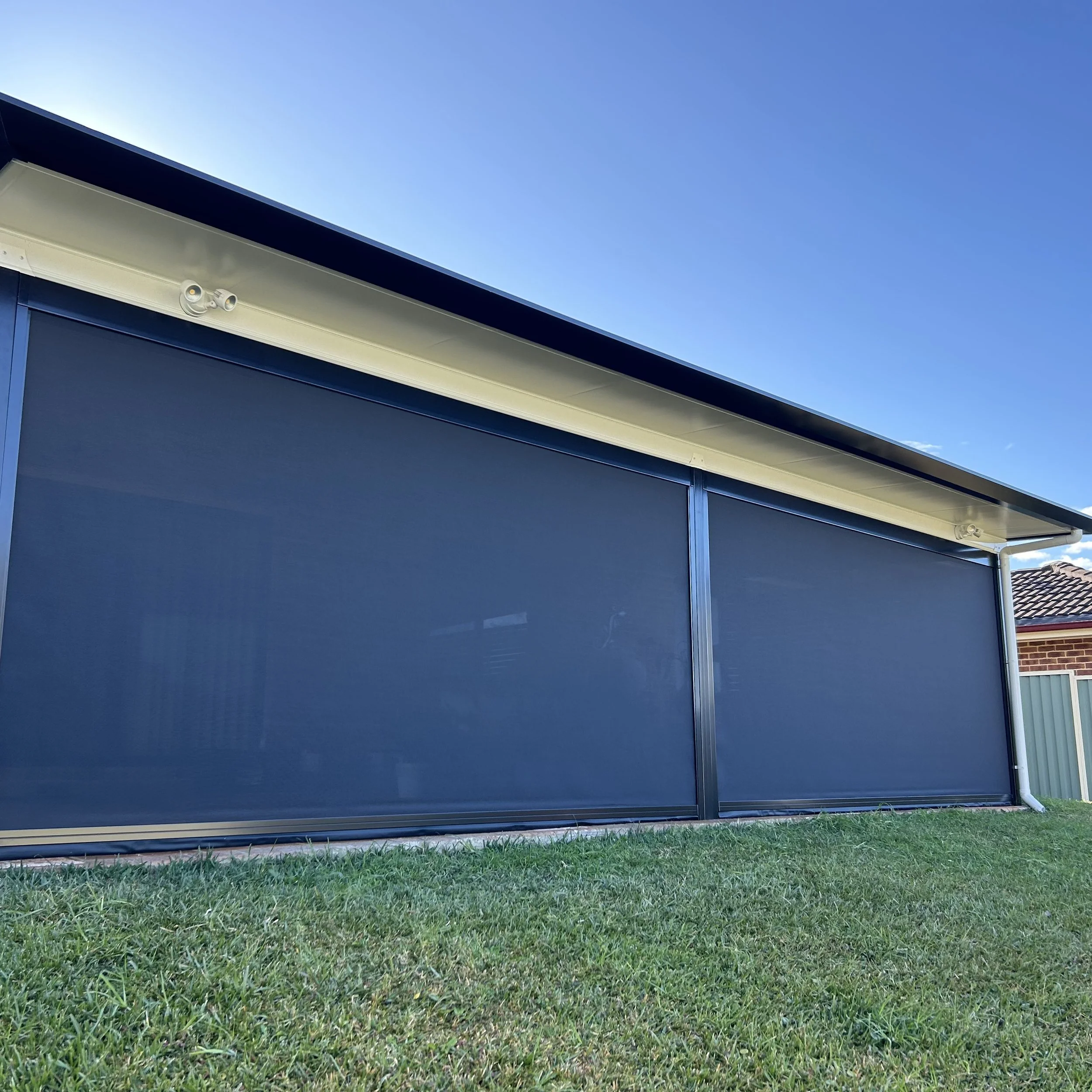 Stratco Outback Cooldek patio with outdoor blinds and privacy fencing crafted by Platinum Decks to create a premium, sheltered alfresco zone