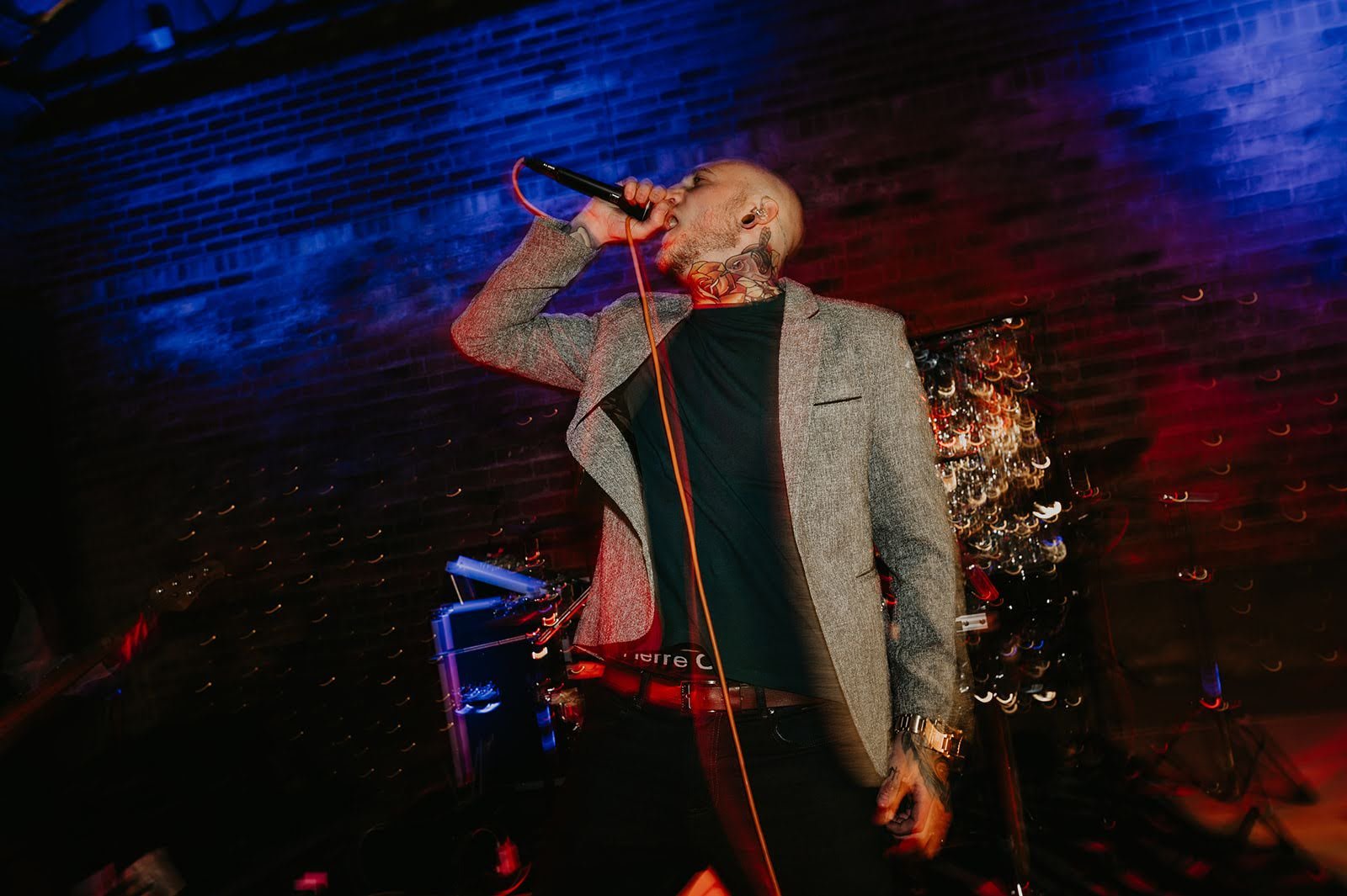 Live wedding singer performing on stage, showcasing alternative wedding entertainment and music services.